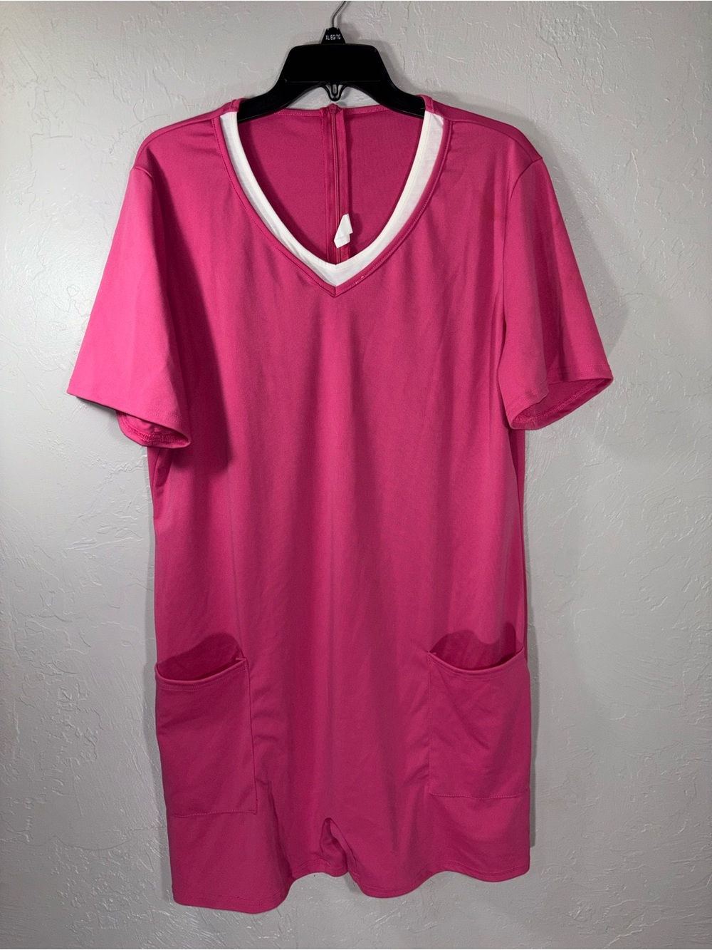 Women's Hot Pink V-Neck Short Romper with Front Pockets. Zipper in back.